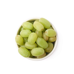 White grapes in a ceramic bowl isolated