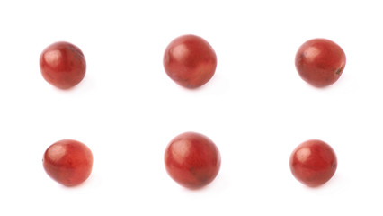 Six single dark red grapes isolated