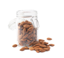 Glass jar filled with almonds isolated