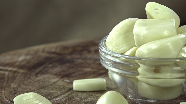 Portion of peeled Garlic (seamless loopable)
