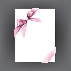 Fototapeta premium White paper card with gift pink satin bow