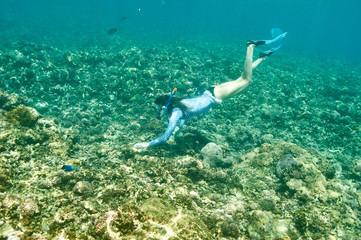 Woman with mask snorkeling