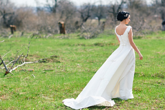 The bride on a green meadow