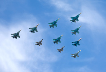 Fototapeta na wymiar Russian military aircraft fighters in flight in blue sky