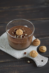 chocolate mousse with almond biscuits and nuts 