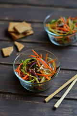 fresh salad with zucchini and carrots in an Asian style 