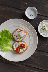 sandwiches with radish, cherry tomatoes and cheese 