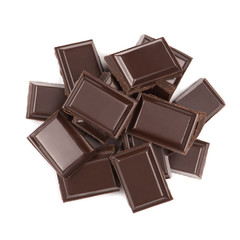 Stack of broken milk chocolate bars close up