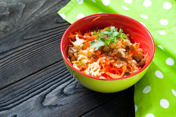 salad with fresh carrots, apples and raisins