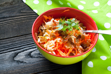 salad with fresh carrots, apples and raisins