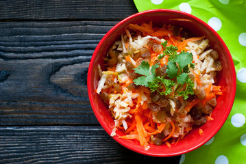 salad with fresh carrots, apples and raisins