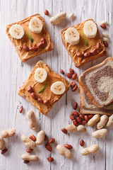 Funny sandwiches for children with peanut butter top view
