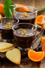 Chocolate dessert with oranges in a glass.