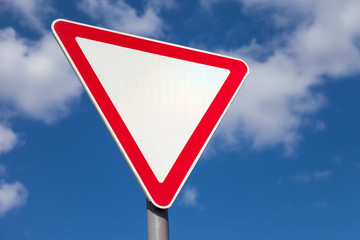 Traffic sign against blue sky background