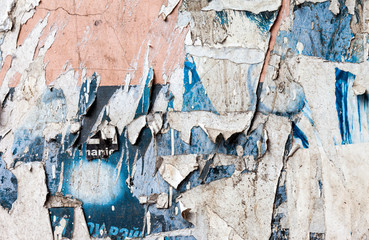 Wall with scraps of old paper as background