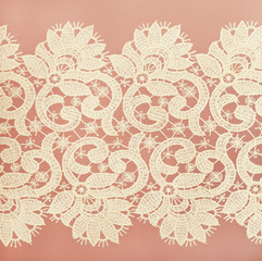 Fototapeta premium White lace on pink background