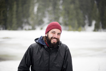 young beardred male hiking outdoors in carpathians mountains