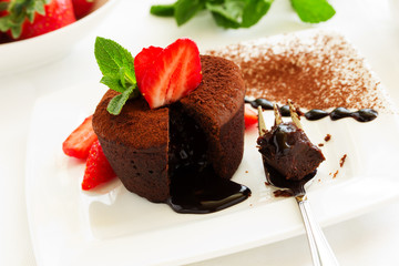 chocolate pudding with fudge center with strawberries,