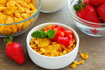 Honey cereals with strawberries for breakfast.