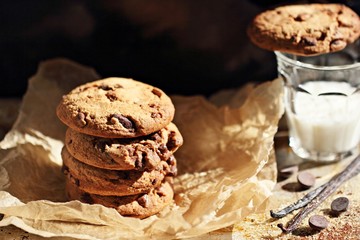 Chocolate cookies with chocolate chips on a rustic wooden table 