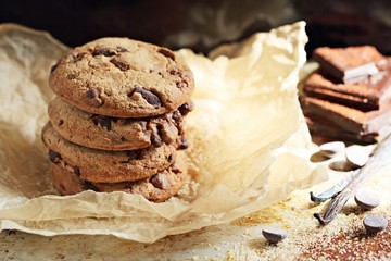 Chocolate cookies with chocolate chips on a rustic wooden table 
