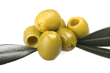 Pitted green olives close up on the white