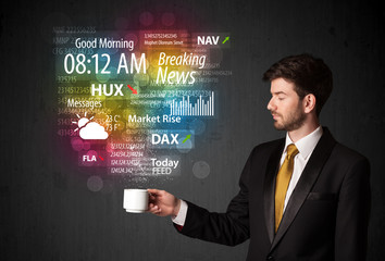 Businessman holding a white cup with daily news and information