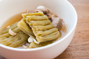 Bitter Gourd Soup with Pork in a Bowl on Wood Table