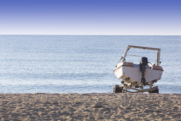 Fototapeta na wymiar Boat on the Sand