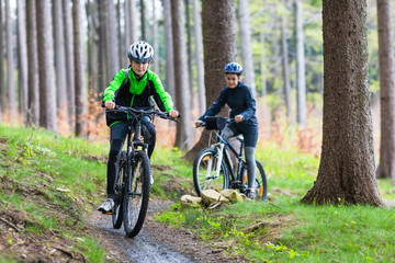 Healthy lifestyle - teenage girl and boy cycling