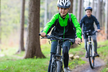 Healthy lifestyle - teenage girl and boy cycling