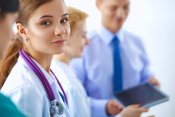 Woman doctor standing with stethoscope at hospital