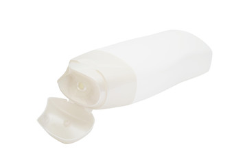 white  plastic  cosmetic bottle with opened lid on white background
