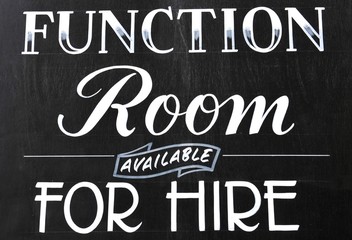 Function room for hire sign on blackboard