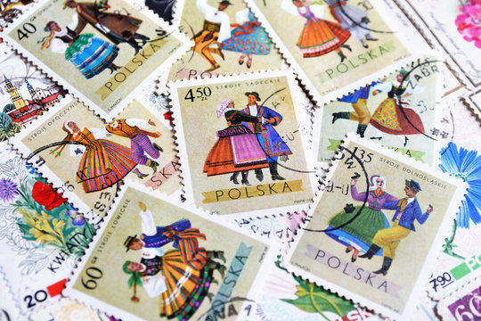 Various old vintage Polish post stamps with national clothes