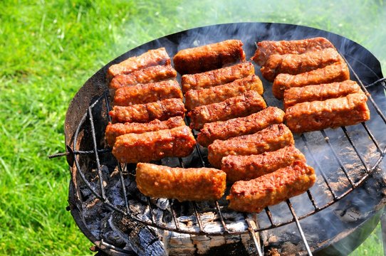 Close up of barbecue against green grass