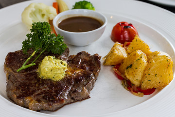 rib eye steak on white dish