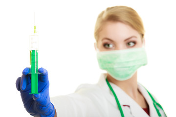 Woman doctor or nurse with syringe isolated