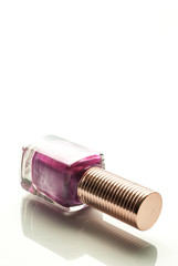 Bottles with nail polish over white