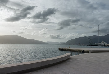 View of Bay of Kotor in foggy day. Tivat city, Montenegro