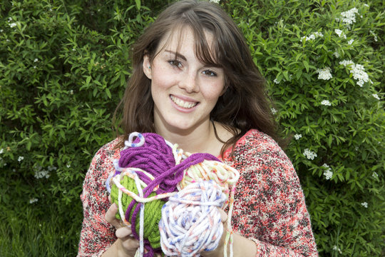 Young Woman With Bale Of Wool