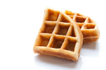 Freshly baked belgium waffles isolated on white background