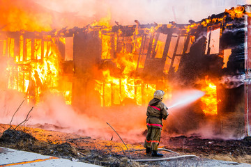 Fototapeta premium Fireman extinguishes a fire