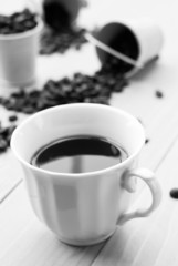 Obraz na płótnie Canvas Coffee cup and beans on a white background
