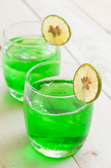 Cocktail with fresh wet lemons on white background