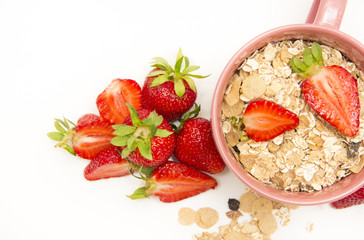 Bowl of muesli, strawberries for healthy breakfast