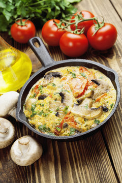 Omelet with mushrooms and tomatoes. Frittata
