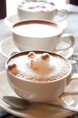 Latte' Art Coffee,Cup of latte coffee on wooden background