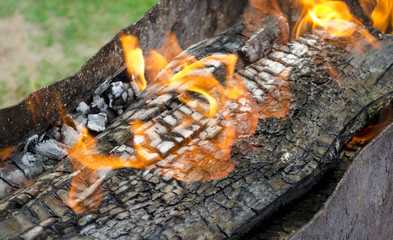Burning flame the coals in the grill