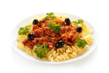 Pasta with meat, tomato sauce and vegetables on white background